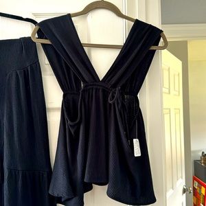 Sexy and trendy, free people, ride leg, ribbed, black pants & cropped tank top.